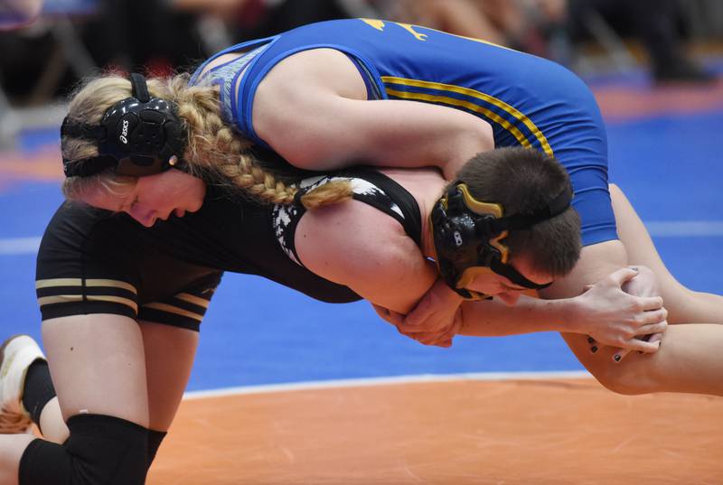 Joe Lewnard/jlewnard@dailyherald.com
Wheaton North’s Ava Gruenwald, top, and Oak Forest’s Brooke Hale compete in a 115-pound match during the Hoffman Estates girls wrestling invite Saturday.
