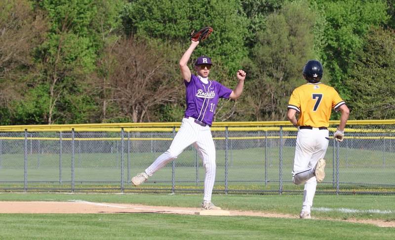 Rochelle's Brody Bruns comes down with a high throw at first base for the out during the Hubs' game with Sterling.