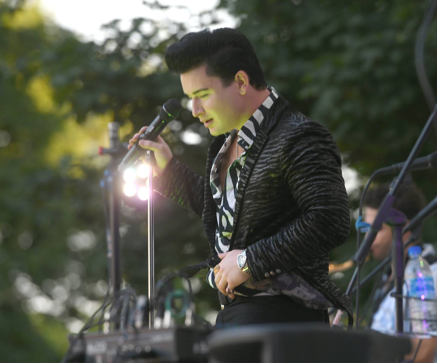 Jonny Lyons performs an Elvis Presley song at the Mt. Morris Jamboree on Friday, July 22. Jonny Lyons and the Pride made their debut performance at the free music series in downtown Mt. Morris. Lyons also performed hits by Johnny Cash and other Top 40 performers in front of a large crowd.