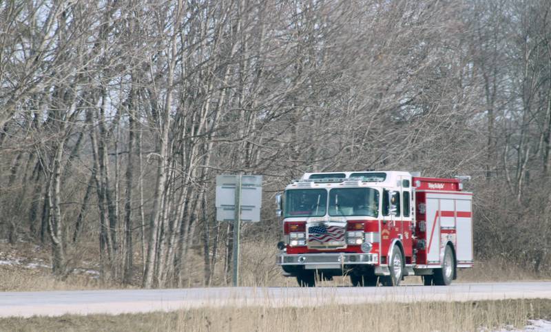 A fire engine rolls past along the Interstate 180 bypass adjacent to the Marquis Industrial Complex on Saturday, Feb. 4, 2023, in rural Hennepin.