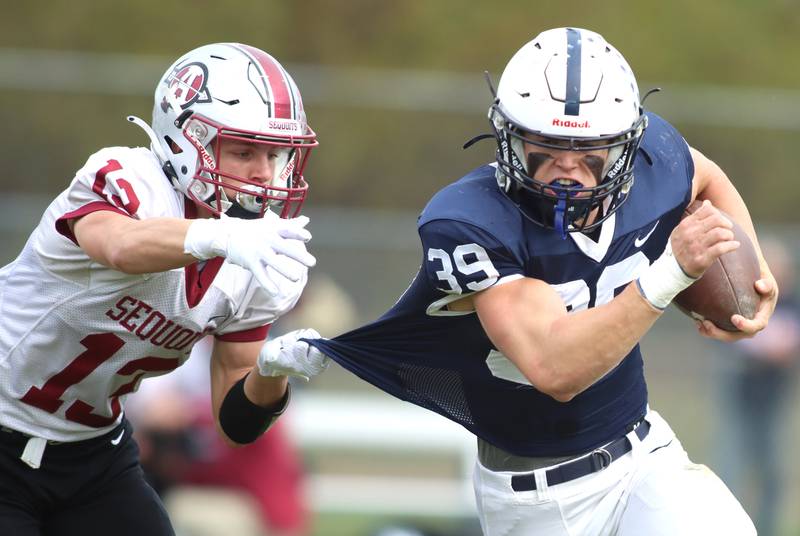 Cary-Grove’s Holden Boone gets past Antioch’s Jack Bucar  in IHSA Class 6A second-round playoff football action on Saturday, Nov. 9, 2024, at Al Bohrer Field on the campus of Cary-Grove High School in Cary..