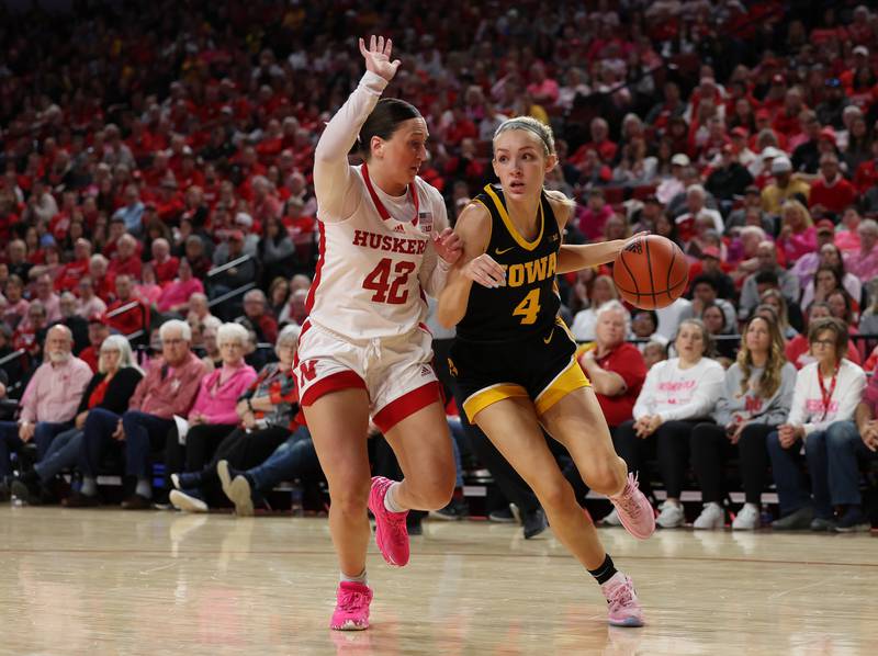 Iowa Hawkeyes guard Kylie Feuerbach (4) drives against Nebraska on Sunday, February 11, 2024 at Pinnacle Bank Arena in Lincoln, Neb. (Brian Ray/hawkeyesports.com)