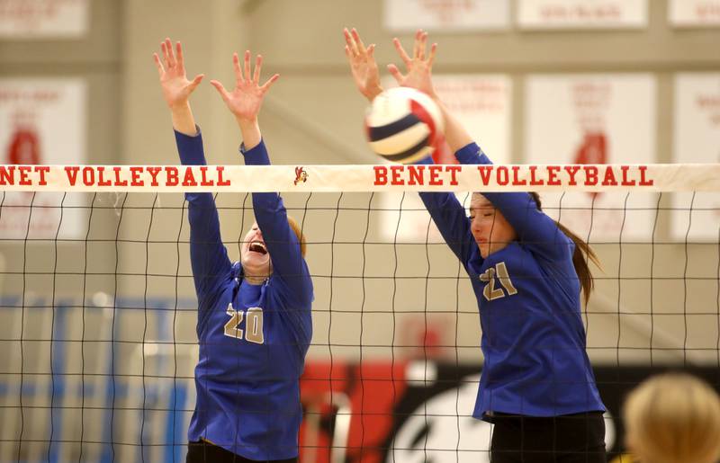 St. Charles North’s Brianna Dale (left) and Brynn Hopkins go up for a block during a game on Monday, Oct. 7, 2024 at Benet in Lisle.