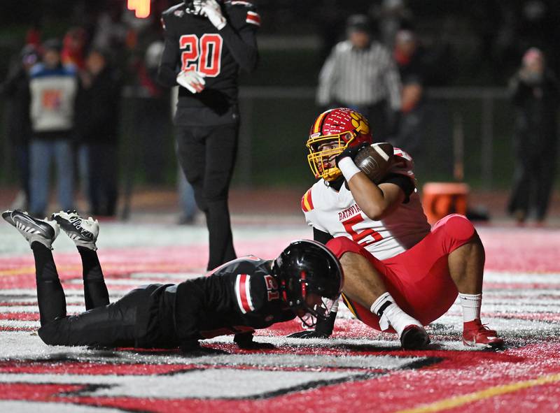 Batavia's Nicholas Mabbs (5) tries to catch a pass for a 2 point conversion during the Class 7A semifinal playoff game against Lincoln-Way Central on Saturday, Nov 23, 2024 at New Lenox. (Dean Reid for Shaw Local News)