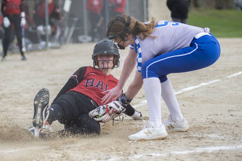 Hall's Mya McLaughlin slides in safely at home as Newman's Ady Waldschmidt puts down the tag late Tuesday, April 19, 2022.