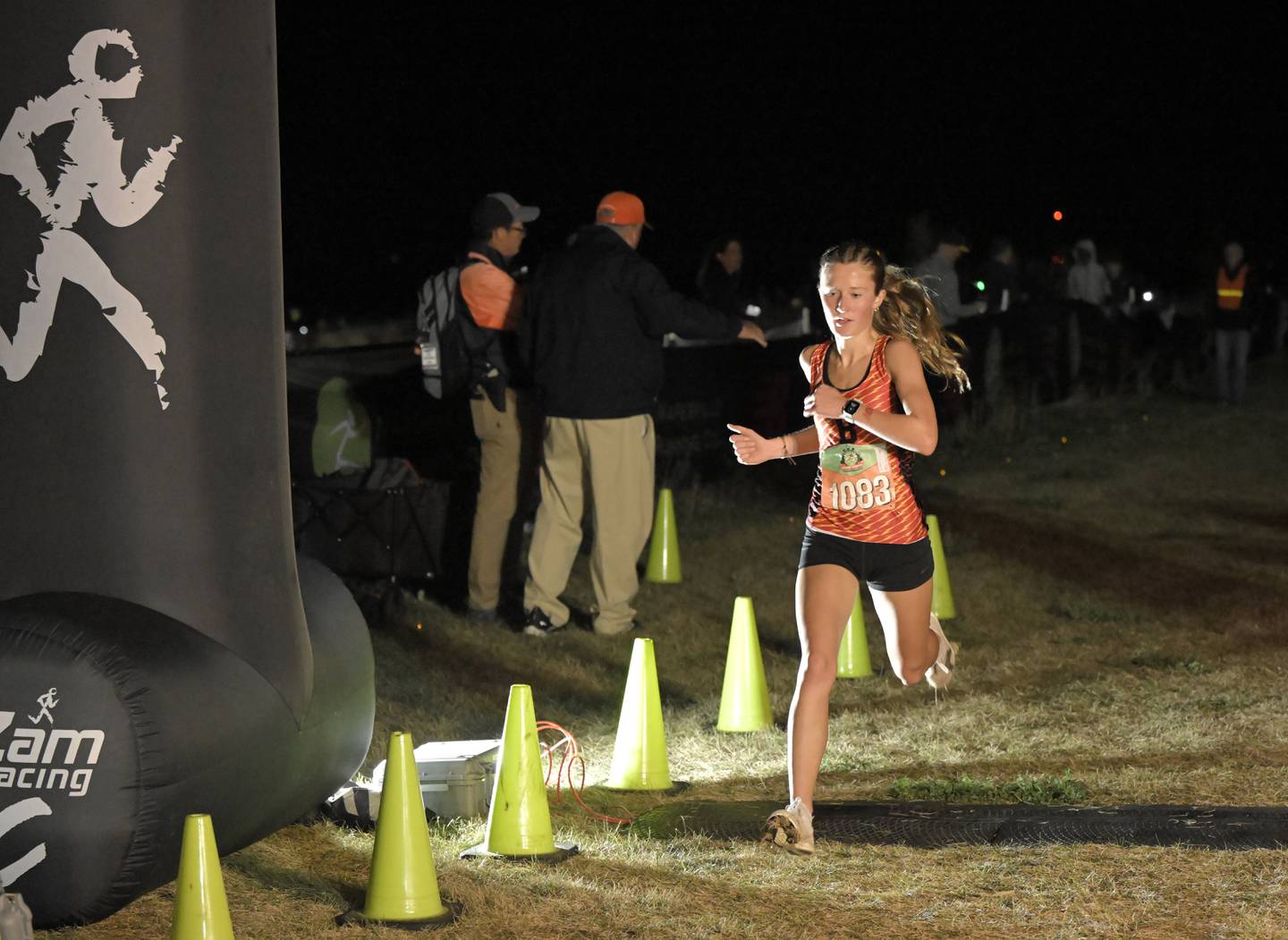 Batavia’s Avery Hacker finishes third in the girls varsity race at the annual Naperville North Twilight Cross Country meet, this year at Settler’s Hill in Geneva on Wednesday, Oct. 8, 2025.