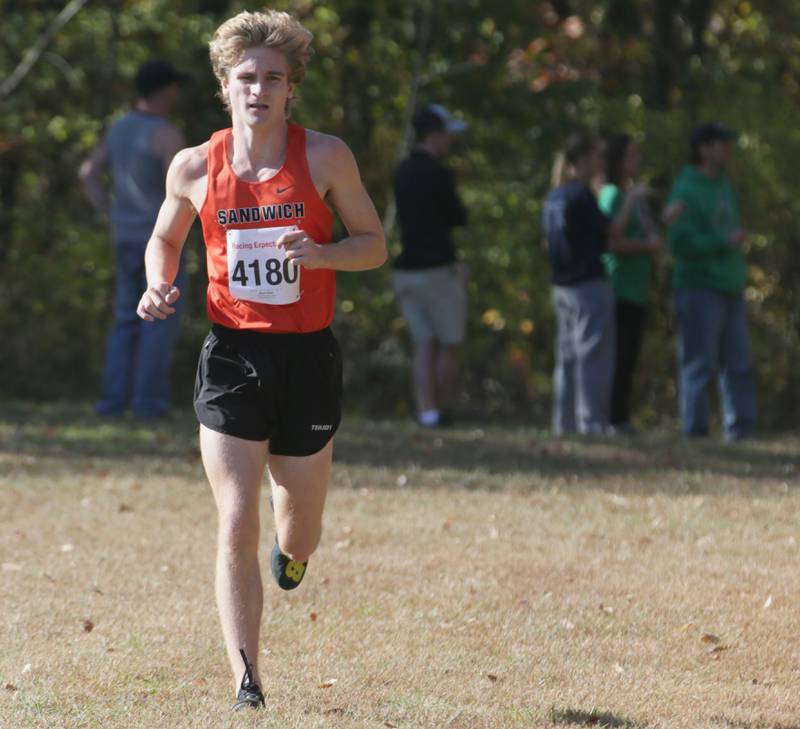 Sandwich's Wyatt Miller runs in the Class 1A Regional Cross Country boys race on Saturday, Oct. 22, 2022 at the Seneca FFA Farm in Marseilles.
