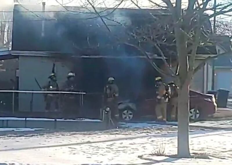 Firefighters work the scene of a garage fire Monday morning on the 400 block of West Jeffery Street. The car was a total loss, and the garage sustained an estimated $15,000 in damages, Kankakee Fire Chief Bryan LaRoche said.