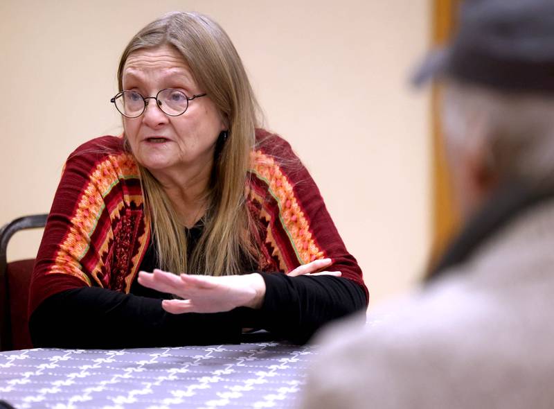Marreen Buntaine, director of the community empowerment campaign with the Unitarian Universalist Congregation of DeKalb, talks Thursday, Jan. 23, 2025, at the church, about the need the warming center fills for community members. The warming center, which is open nightly during the winter months, offers free hot meals to all and a warm, safe place for those who need a refuge from the cold.