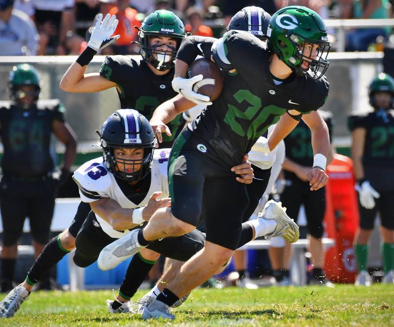 Glenbard West's Joey Campanella (20) escapes the grasp of Downers Grove North's Jake Solecki (13) on a punt return during a game on Sep. 9, 2023 at Glenbard West High School in Glen Ellyn.
Jon Cunningham for Shaw Local News Network