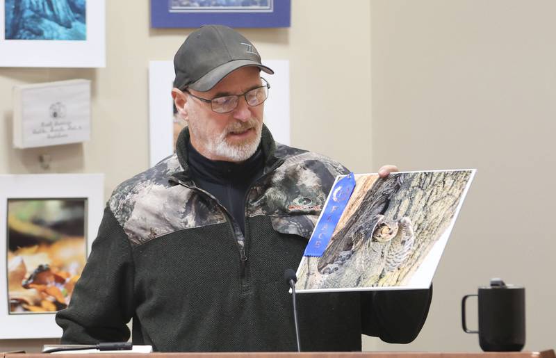 Leroy Buckley of Oglesby, talks about his first place photo of a great horn owl nest during the Starved Rock Photography Show awards on Saturday, Jan. 3, 2026 at the Starved Rock Visitors Center.