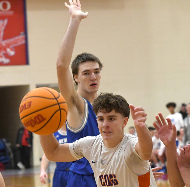 Genoa-Kingston's Jaiden Lee reaches for the ball during the Cogs' game with Sterling Newman at the Oregon Boys Basketball Thanksgiving Tournament on Wednesday, Nov. 26, 2025 at Oregon High School.