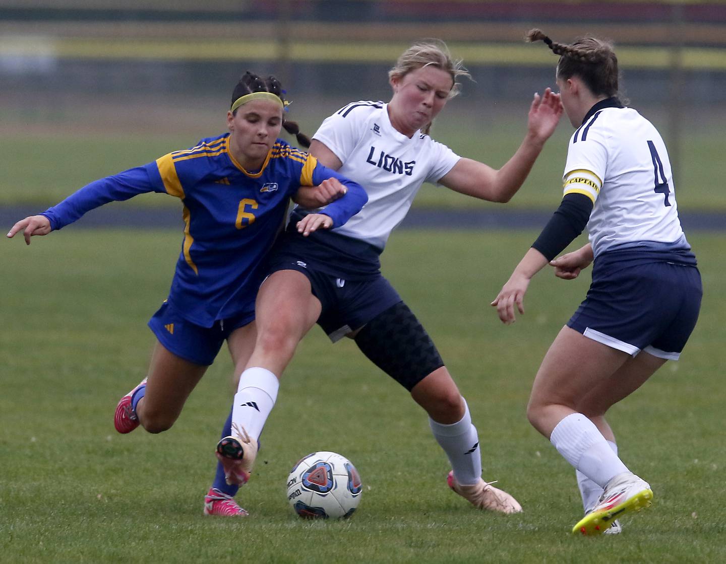 Johnsburg's Liz Smith battles with Harvest Christian Academy's Lily Johnson and Hanne Giovenco for control of the ball during the Class 1A Marian Central Girls Soccer Regional Championship match on Tuesday, May 20, 2025, at Marian Central High School in Woodstock.