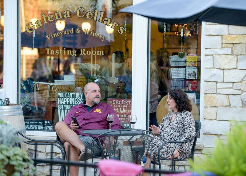 Chris and Joy Goebbert of Glen Ellyn enjoy some wine on Galena Cellars outdoor patio during first downtown Geneva First Fridays event since the coronavirus pandemic Sept. 4.