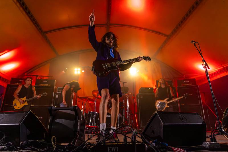 Kyle Lapato of Thunderstruck points up during performance at the annual Cops for Cancer event on Friday, July 25, 2025, at Cerri Memorial Park in Cedar Point.