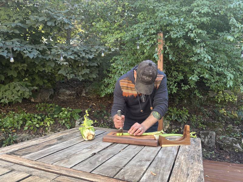 Army veteran and Trout Valley resident Doug Katz demonstrates the ergonomic uses of the Nulu kitchen knife specially designed for people with mobility disabilities.