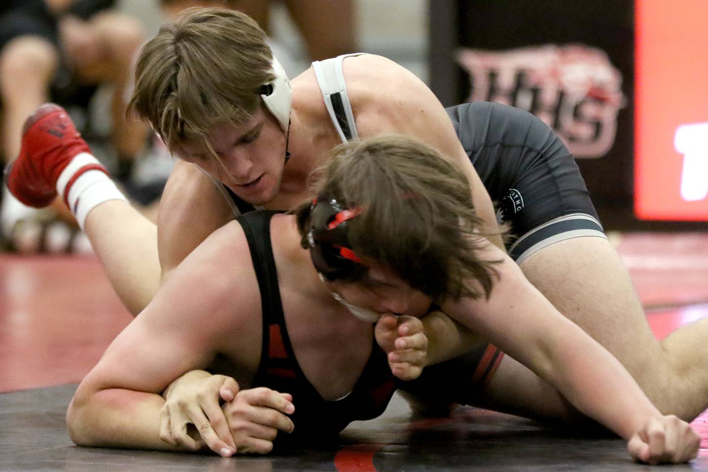 Marian Central's Dylan Connell, top, looks for the advantage over Huntley's Ryder Hunkins in their 195 pound bout during a wrestling triangular meet involving teams from Huntley, Marian Central, and Barrington at Huntley High School on Friday, June 4, 2021 in Huntley.