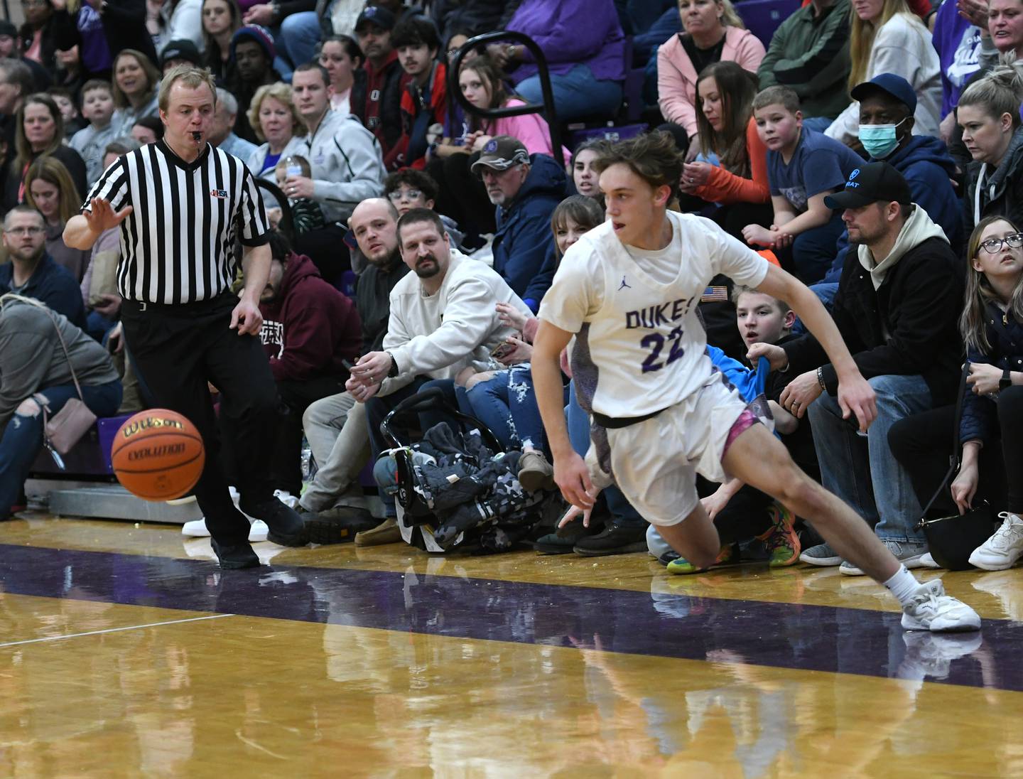 Dixon's Bryce Feit (22) tries to save a loose ball from going out of bounds during Big Northern Conference action against Byron on Tuesday, Jan. 31 at Lancaster Gym.