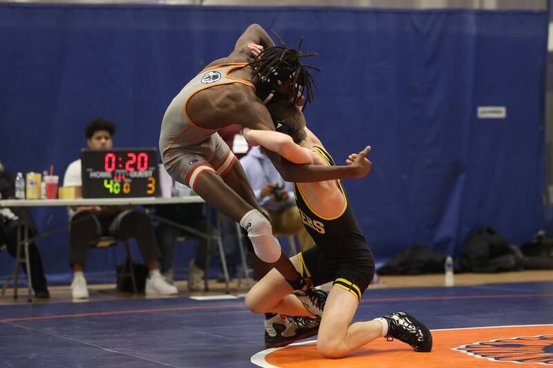 Joliet West’s Jakob Candall drops Romeoville’s Savion Essiet for a match winning two points in the final seconds in a dual meet on Thursday, Dec.14th, 2023 in Romeoville.