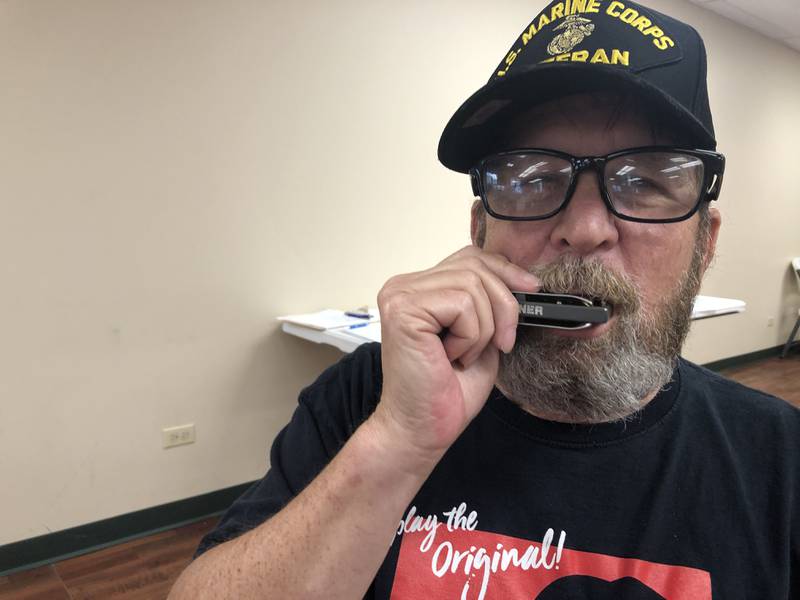 Mark Jaeger is teaches harmonica lessons Wednesday afternoon at the McHenry Township Senior Center in Johnsburg on Wednesday, July 12, 2023. Jaeger learned to play as a 19-year-old stationed in Hawaii.