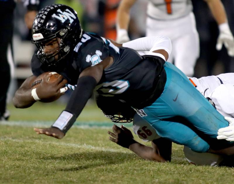 Woodstock North’s David Randecker dives for yardage against Freeport in first-round IHSA Playoff football action on Saturday, Nov. 2, 2024 at Woodstock North High School in Woodstock.