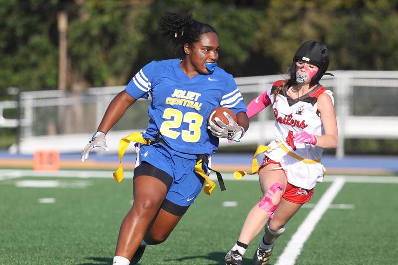 Joliet Central’s Georgianna Majerus (23) rushes to the outside in her team's inaugural flag football game against Bradley-Bourbonnais on Thursday, Aug. 29, 2024, in Joliet.