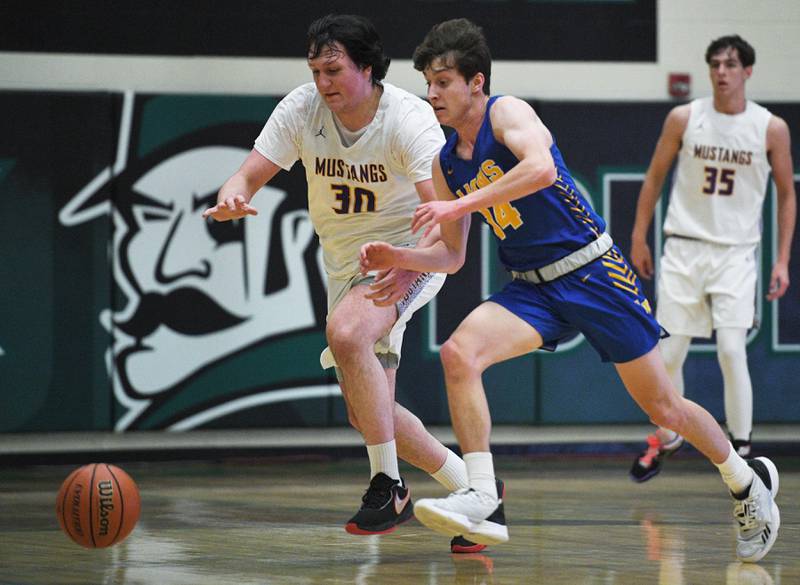 John Starks/jstarks@dailyherald.com
Rolling Meadow’s Mark Nikolich-Wilson and Lyon’s Connor Carroll chase a loose ball in the Jack Tosh boys basketball tournament at York High School in Elmhurst on Friday, December 30, 2022.
