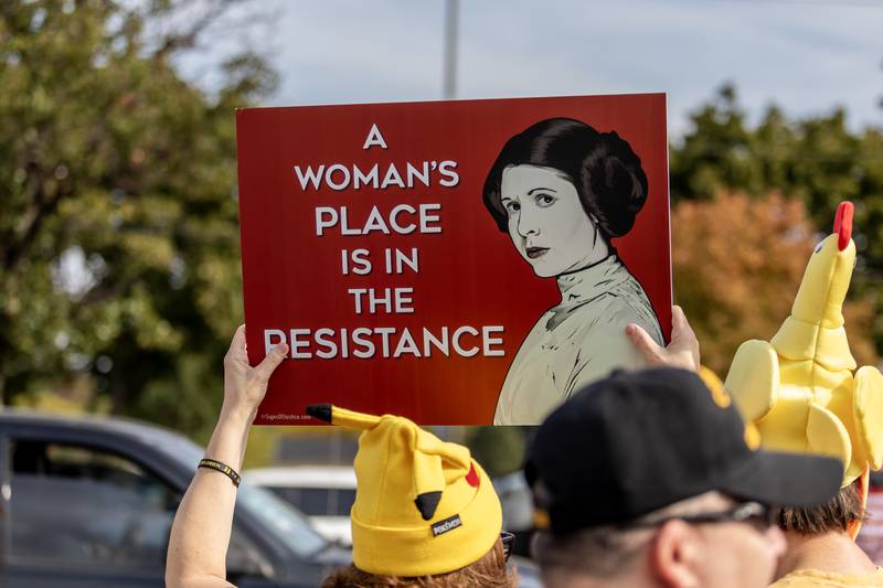 A protestor holds a sign of resistance during the No Kings Protest at Mall Loop Drive in Joliet on Oct. 18, 2025.