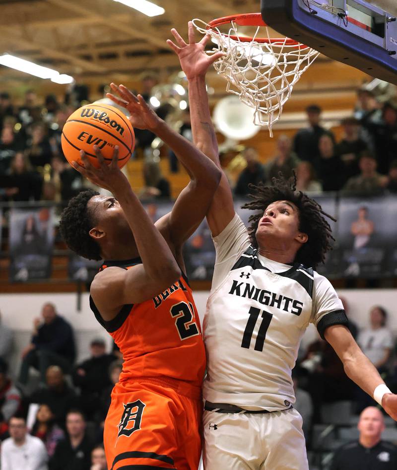 DeKalb's Justin O’Neal tries to shoot over Kaneland's Evan Frieders during their game Tuesday, Jan. 28, 2025, at Kaneland High School in Maple Park.