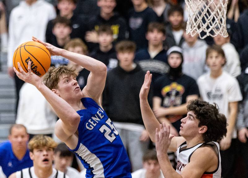 Geneva Hudson Kirby goes up for a layup during an away game against Wheaton Warrenville South High School on Tuesday, Dec. 3, 2024.