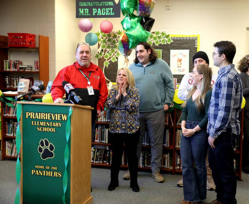 Prairieview Elementary School Principal Mark Pagel is surrounded by his family after his surprise announcement as Illinois Principals Association Principal of the Year at the Downers Grove school on Wednesday, March 9, 2022. Prairieview is part of Center Cass School District 66.
