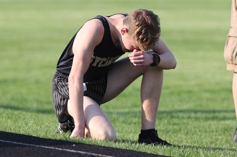 Sycamore's Ethan Solfisburg catches his breath after the 3200 meter run Friday, May 13, 2022, during the Interstate 8 Conference Championship meet at Sycamore High School.