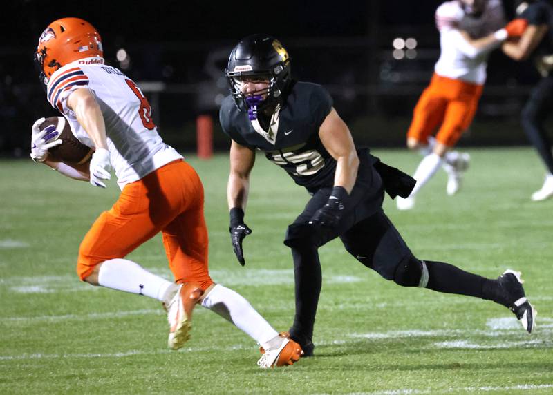 Sycamore's Dalton Fahrlander pressures Mahomet-Seymour quarterback Wade Manuel during their game Friday, Sept. 12, 2025, at Sycamore High School.