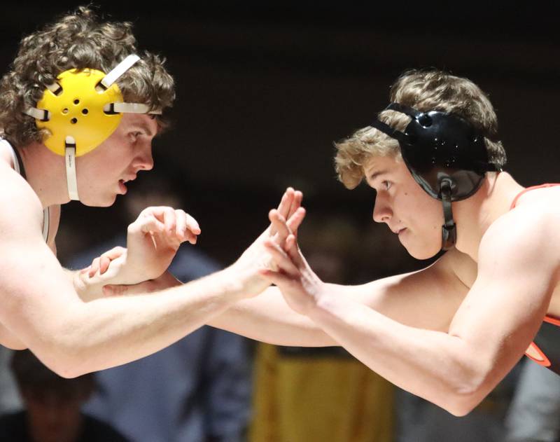 Crystal Lake Central’s Jack Kassner, right, battles Jacobs’ Lucas Retzler at 215 pounds in varsity boys wrestling on Tuesday, Jan. 20, 2026 at Crystal Lake Central High School in Crystal Lake.