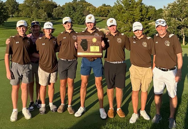 Carmel High School's boys golf team and coaches pose with the Class 2A Freeport Sectional championship plaque on Monday at Park Hills Golf Course.