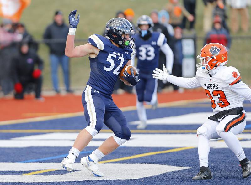 IC Catholic's Jesse Smith (52) intercepts the ball in the end zone during the Class 3A varsity football semi-final playoff game between Byron High School and IC Catholic Prep on Saturday, Nov. 19, 2022 in Elmhurst, IL.