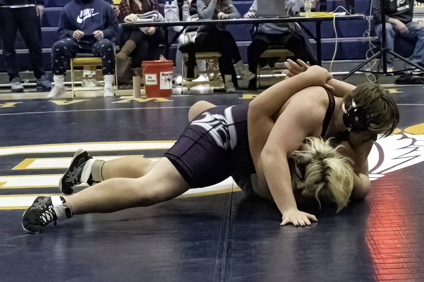 Dixon's Sean DeVries (top) pins Fulton's Braiden Damhoff during their 285-pound title bout at the 44th annual Carson DeJarnatt Tournament on Saturday, Dec. 3, 2022 at Musgrove Fieldhouse in Sterling.
