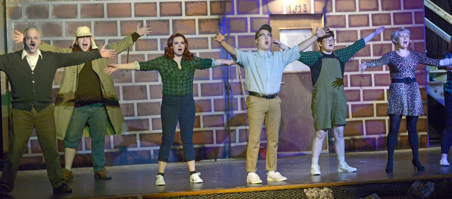 The cast of "Little Shop of Horrors," which opens Nov. 10, 2023, rehearses a scene at Stage 212. The sci-fi hit musical by Howard Ashman and Alan Menken, tells the story of Seymour, a down-on-his-luck florist whose fortunes change when he discovers an exotic plant. Unknown to Seymour, the plant is an alien with evil designs.