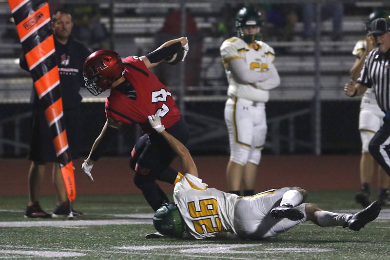 Huntley's Haiden Janke breaks the tackle attempt of Crystal Lake South's Anthony Gountanis to score a touchdown during a Fox Valley Conference football game on Friday, Sept. 29, 2023, at Huntley High School.