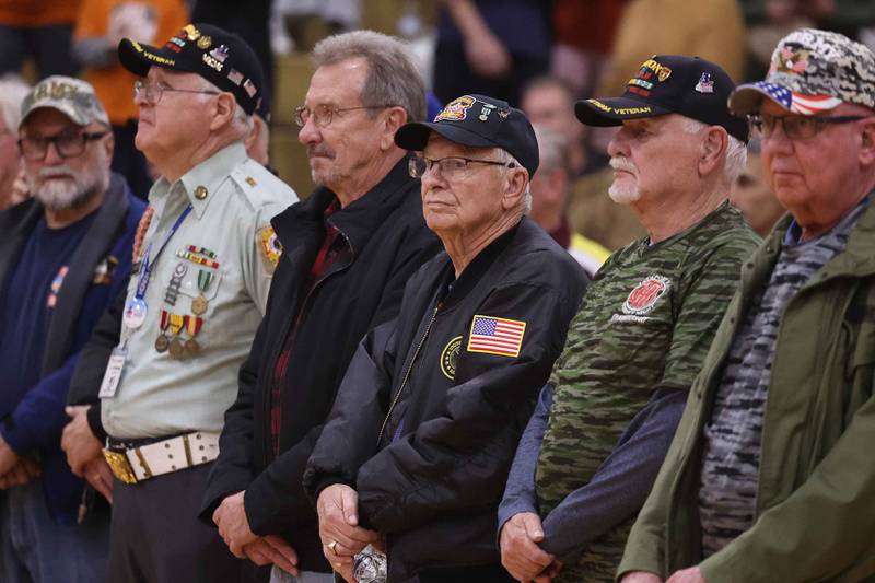 Army veterans line up after being introduced at the Lockport Township High School 10th Annual Veterans Night Celebration on Friday, Dec. 6, 2024.