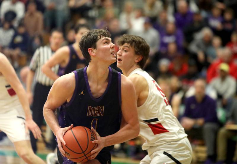 Downers Grove North’s Jake Riemer looks for an opening during the Jack Tosh Holiday Classic semifinals against Metamora at York High School in Elmhurst on Friday, Dec. 29, 2023.