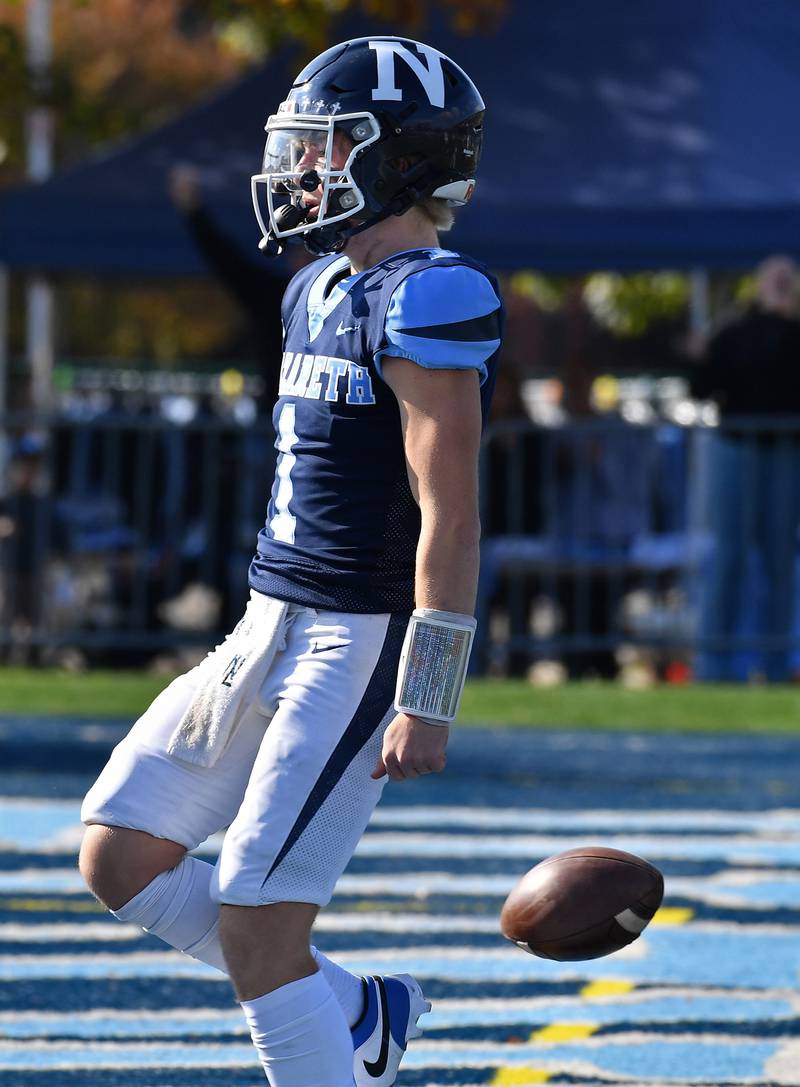 Nazareth quarterback Logan Malachuk drops the ball in the end zone after scoring a touchdown during a Class 5A second round game against Glenbard South on Nov. 4, 2023 at Nazareth Academy in LaGrange Park.