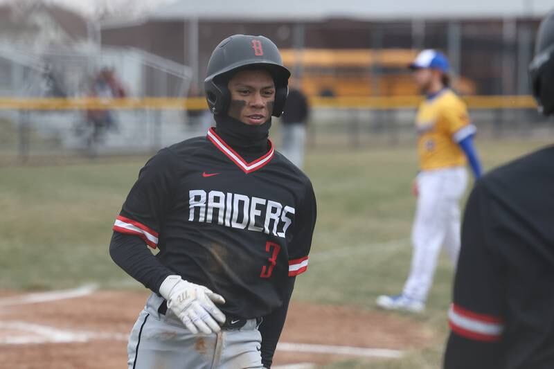 Bolingbrook’s Jordan Gozum heads to the dugout after scoring on a wild pitch against Joliet Central on Tuesday, March 21st. 2023.