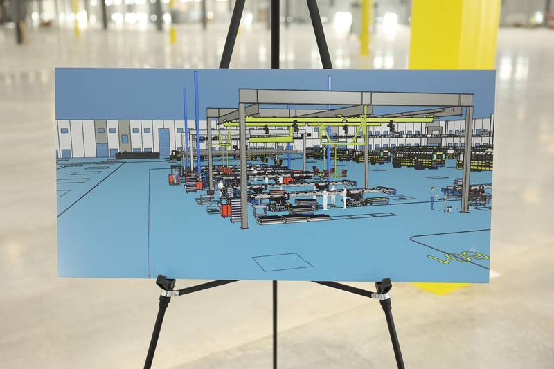 Artist renderings of the Lion Electric assembly lines are displayed throughout the plant during a press conference and interactive tour the new manufacturing facility.. Monday, Mar. 21, 2022, in Joliet.