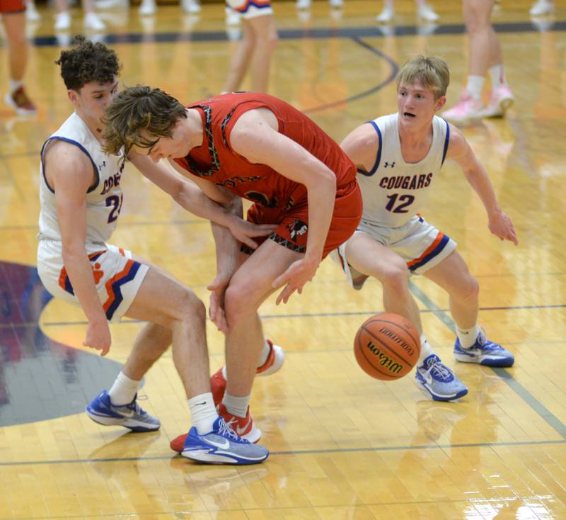 Eastland's Peyton Spears (20) and Adam Awender (12) trap South Beloit's Ross Roberston at mid court on Tuesday, Feb. 27, 2024 at the 1A River Ridge Sectional.