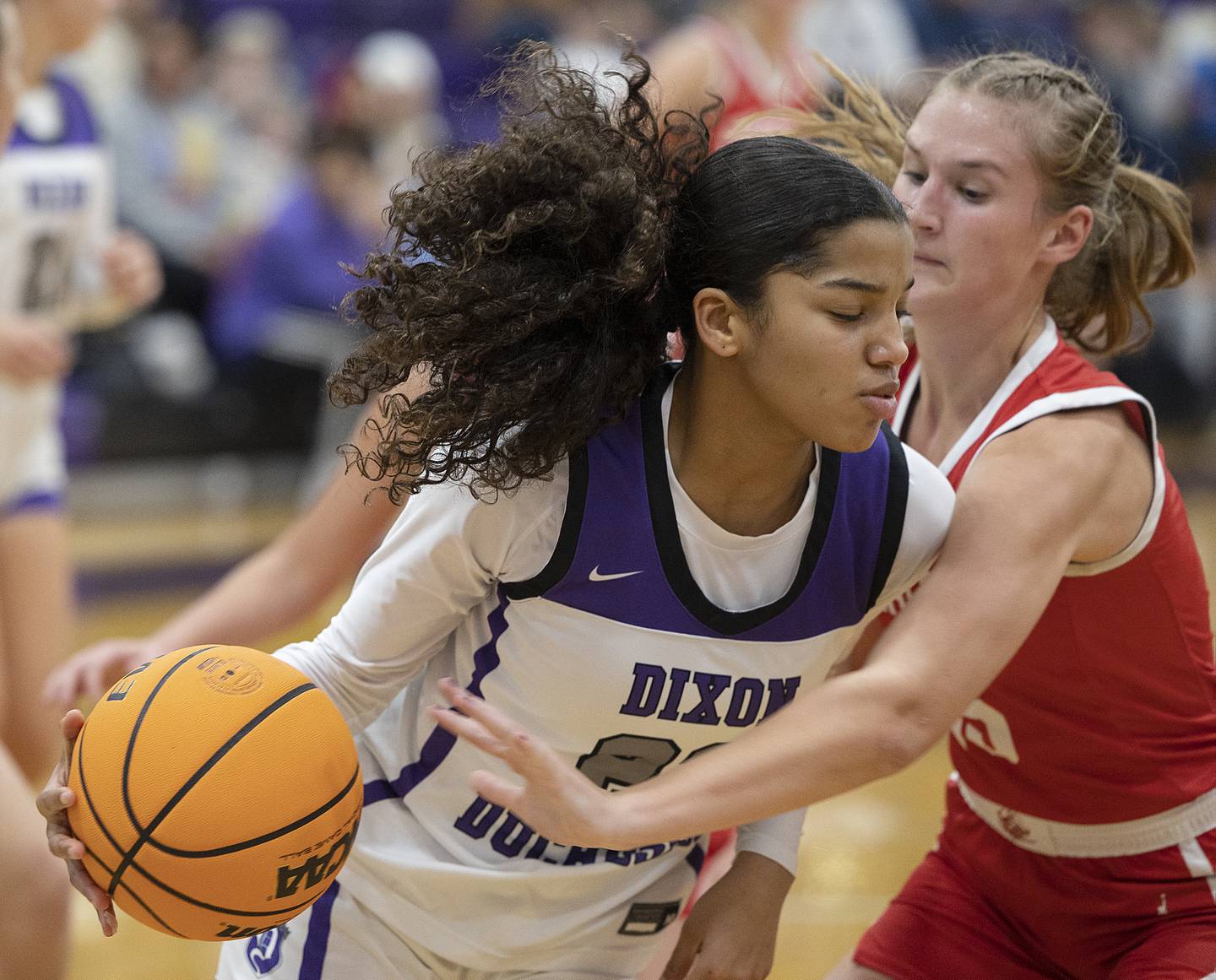Dixon’s Ahmyrie McGowan handles the ball after a rebound against Ottawa Wednesday, Dec. 4, 2024, at Dixon High School.