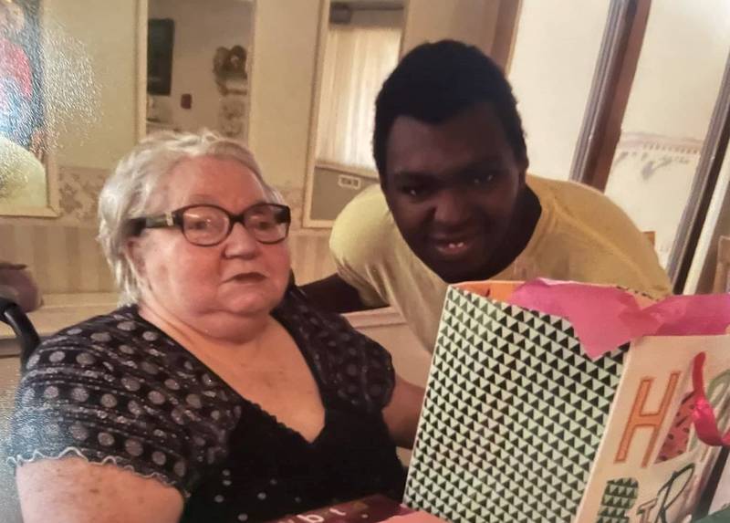 Carol Juricic, formerly of Wilmington, is seen with her son Tony on her 80th birthday. Juricic cared for more than 250 foster children over 25 years and adopted four children.