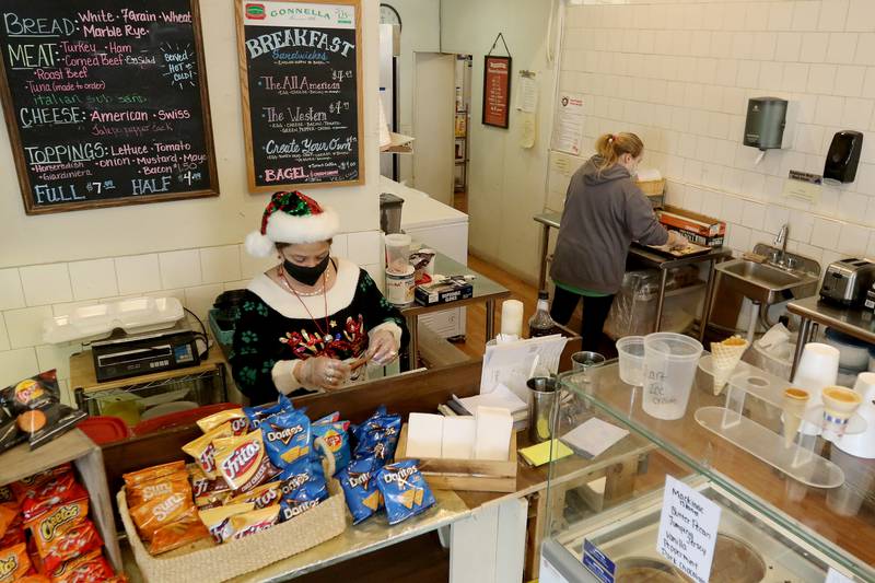 General Store employees Sharon Consentino, left, and Chloe Scott, right, work on making food Tuesday, Dec. 15, in Greenwood. The building has been a general store since its construction in 1894 and was also the township's post office.