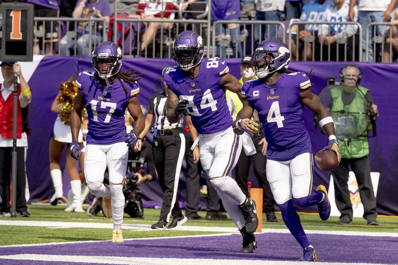 Minnesota Vikings running back Dalvin Cook (4) reacts after scoring a touchdown against the Detroit Lions during the first half of an NFL football game, Sunday, Sept. 25, 2022 in Minneapolis. (AP Photo/Stacy Bengs)