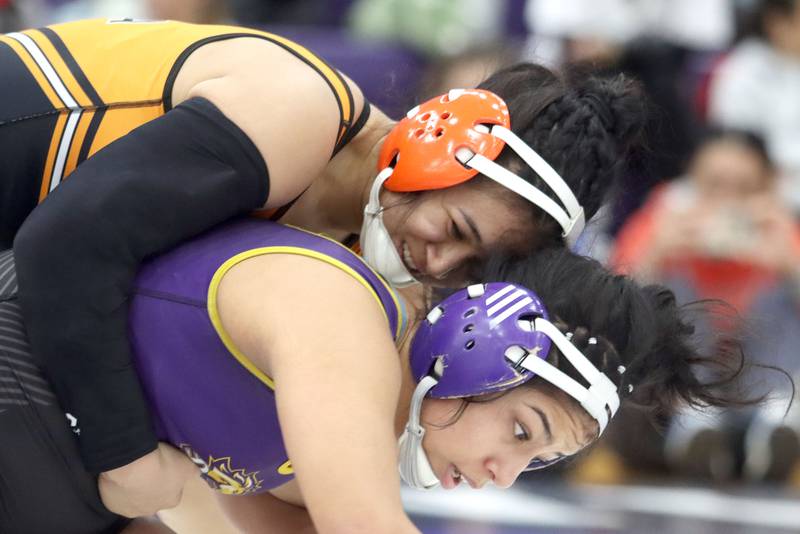 McHenry’s Natalie Corona, top, battles Rolling Meadows’ Janet Brindis at 145 pounds in varsity girls IHSA Regional Championship wrestling action on Saturday, February 7, 2026, at Hampshire High School in Hampshire.